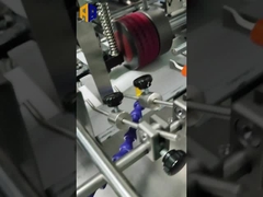 - Une machine à plier à la broche de papier